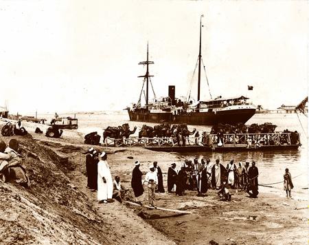 Kantara. Km. 45. Camel ferry and ships in transit.