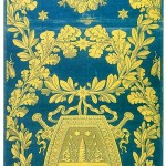 Blue damask with a yellow border and a shield motif decoration